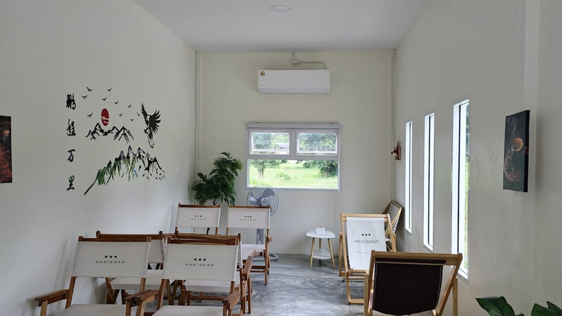 Minimalist yoga studio with natural light and wooden floor